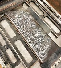 Load image into Gallery viewer, Zinc block on the Vandercook press.